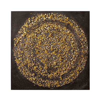 Decorative plate with a circular pattern of gold and black stones on a dark background