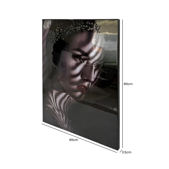 Framed artwork of a woman's face with measurements on a white background