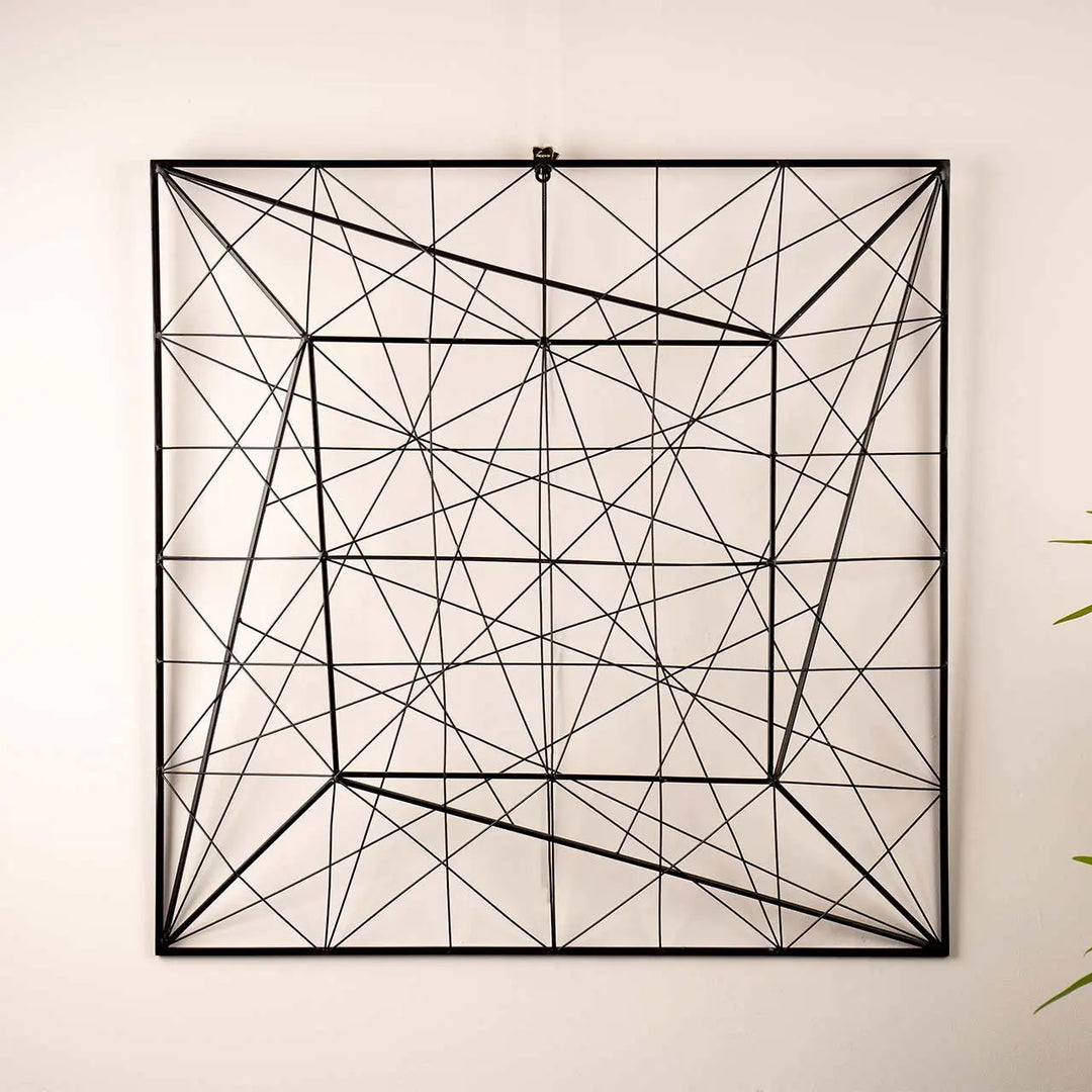 Geometric wall art with black lines on a light beige background