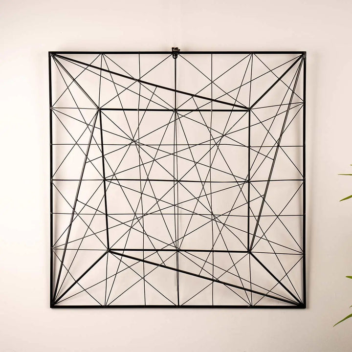 Geometric wall art with black lines on a light beige background